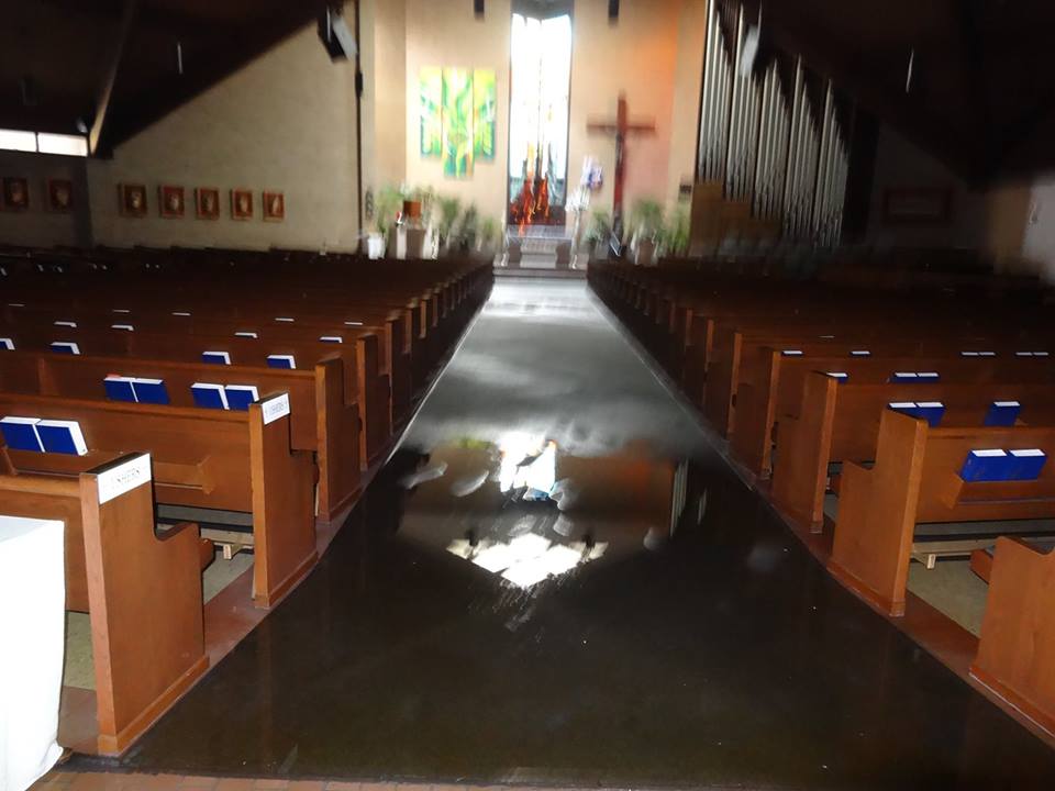 Flooded sanctuary of Saint Alphonsus Church in Greenwell Springs, LA